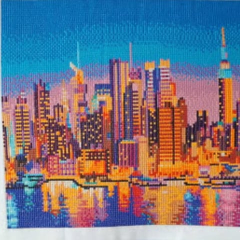 Colorful pixelated cityscape featuring a skyline with tall buildings reflected in water below, in vibrant blues, purples, oranges, and pinks