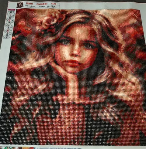 Diamond painting canvas featuring a portrait of a woman with long blonde wavy hair against a red and black background